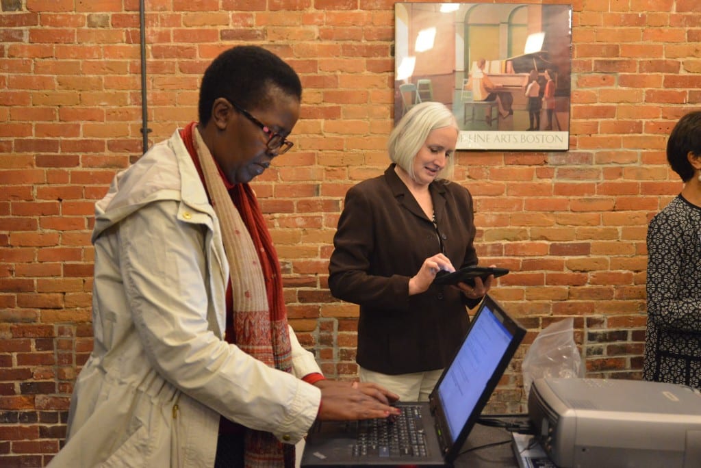 Dr. Lindiwe Majele Sibanda takes the opportunity to sign the Lewiston-Auburn Community Food Charter at the launch event. Individuals, businesses, organizations, municipalities and other groups are encouraged to sign the Food Charter at goodfood4la.org.